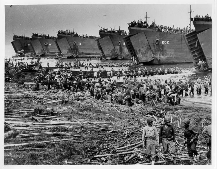 LST-66 (second from left) and other LSTs debarking troops and supplies on the beaches of Leyte Island, the Philippines. (U.S. Coast Guard) LST-66 (second from left) and other LSTs debarking troops and supplies on the beaches of Leyte Island, the Philippines. (U.S. Coast Guard)